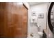 Bathroom with toilet and vanity, featuring patterned floor tiles and storage at 4955 Jeffreys St # 605, Las Vegas, NV 89119