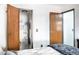 A bedroom with open door to a bathroom and in-unit stackable washer and dryer at 4955 Jeffreys St # 605, Las Vegas, NV 89119