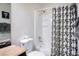 Updated bathroom with shower and tub combination and patterned shower curtain at 4955 Jeffreys St # 605, Las Vegas, NV 89119