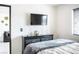 Bedroom with modern furnishings, television and comfortable bed at 4955 Jeffreys St # 605, Las Vegas, NV 89119