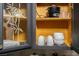 Kitchen cabinet with etched glass design, bamboo, and open shelving displaying dishes and appliances at 4955 Jeffreys St # 605, Las Vegas, NV 89119