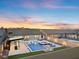 Stunning backyard showcasing a modern pool, spa, bar area, and a putting green, perfect for entertainment at 5081 Notting Hill Ave, Las Vegas, NV 89139