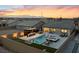 Beautiful backyard featuring a sparkling pool, spa, putting green, and outdoor bar, ideal for entertaining at 5081 Notting Hill Ave, Las Vegas, NV 89139