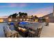 Beautiful backyard featuring a sparkling pool, hot tub, fire pit, bar, and plenty of seating for entertaining at 5081 Notting Hill Ave, Las Vegas, NV 89139