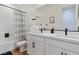 Well-lit bathroom featuring double sinks, modern fixtures, and a shower-tub combo at 5081 Notting Hill Ave, Las Vegas, NV 89139