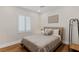 Comfortable bedroom with a cozy bed, window with shutters, and minimalist decor at 5081 Notting Hill Ave, Las Vegas, NV 89139