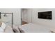 Bedroom with a plush bed, TV, and closet at 5081 Notting Hill Ave, Las Vegas, NV 89139