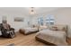 Inviting bedroom with twin beds, neutral color scheme, lots of natural light, and hardwood floors at 5081 Notting Hill Ave, Las Vegas, NV 89139