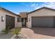 Beautiful home featuring a three car garage and elegant paver driveway at 5081 Notting Hill Ave, Las Vegas, NV 89139