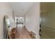 Inviting entryway with hardwood floors, stylish mirror, and decorative bench at 5081 Notting Hill Ave, Las Vegas, NV 89139