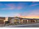 This single-story home boasts desert landscaping, a neutral color scheme, and a spacious two-car garage at 5081 Notting Hill Ave, Las Vegas, NV 89139