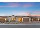 Charming single-story home features a neutral color palette, drought-resistant landscaping, and a two-car garage at 5081 Notting Hill Ave, Las Vegas, NV 89139