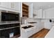 Chef's kitchen featuring stainless steel appliances, custom cabinetry, and quartz countertops at 5081 Notting Hill Ave, Las Vegas, NV 89139
