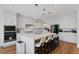 Bright and modern kitchen featuring stainless steel appliances, a center island with seating, and ample counter space at 5081 Notting Hill Ave, Las Vegas, NV 89139