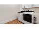 Efficient laundry room with modern washer and dryer, and storage cabinets at 5081 Notting Hill Ave, Las Vegas, NV 89139