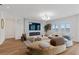 Open-concept living room featuring modern decor, stylish lighting, and a cozy electric fireplace feature at 5081 Notting Hill Ave, Las Vegas, NV 89139