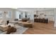 Spacious living area with hardwood flooring, natural light, and views of the dining and kitchen areas at 5081 Notting Hill Ave, Las Vegas, NV 89139