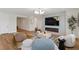 Bright living room with modern fireplace, large TV, stylish lighting, and comfortable contemporary furnishings at 5081 Notting Hill Ave, Las Vegas, NV 89139