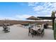 Inviting patio with pool, spa, built-in kitchen, dining area, and lounge seating perfect for entertaining at 5081 Notting Hill Ave, Las Vegas, NV 89139