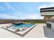 Beautiful pool features sun loungers, spa, a built-in bar, and a green space with a hammock at 5081 Notting Hill Ave, Las Vegas, NV 89139