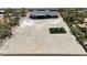 Overhead view of modern home and expansive undeveloped lot with playground equipment at 6235 N Fort Apache Rd, Las Vegas, NV 89149