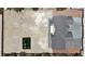 Overhead view of modern home and expansive undeveloped lot with playground equipment at 6235 N Fort Apache Rd, Las Vegas, NV 89149