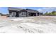 Home exterior showing backyard and small patio area at 6235 N Fort Apache Rd, Las Vegas, NV 89149