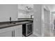 Stylish bar area featuring a sink, wine refrigerator, and ample counter space at 6235 N Fort Apache Rd, Las Vegas, NV 89149