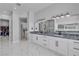 Stylish bathroom with dual sinks, modern lighting, and a glass-enclosed shower at 6235 N Fort Apache Rd, Las Vegas, NV 89149