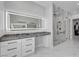Bathroom featuring a vanity, large mirror with vanity lights, and glass walk-in shower at 6235 N Fort Apache Rd, Las Vegas, NV 89149
