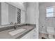 Modern bathroom has a spacious vanity and toilet with a decorative shower at 6235 N Fort Apache Rd, Las Vegas, NV 89149
