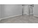 Tiled floors, base trim, and three doorways are highlighted in this simple bedroom at 6235 N Fort Apache Rd, Las Vegas, NV 89149