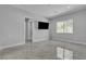 Simple yet modern bedroom features tiled floors, a window, and a television at 6235 N Fort Apache Rd, Las Vegas, NV 89149