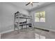Neutral-toned bedroom with bunk bed and a window with natural light at 6235 N Fort Apache Rd, Las Vegas, NV 89149