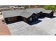 Modern home showcasing a gray tile roof and a spacious concrete driveway at 6235 N Fort Apache Rd, Las Vegas, NV 89149
