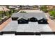 Modern home featuring a gray tile roof, large driveway, and fenced yard at 6235 N Fort Apache Rd, Las Vegas, NV 89149