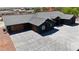 Modern home showcasing a gray tile roof and a spacious concrete driveway at 6235 N Fort Apache Rd, Las Vegas, NV 89149