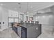 Gourmet kitchen featuring a large island, stainless steel appliances, modern finishes, and a spacious open layout at 6235 N Fort Apache Rd, Las Vegas, NV 89149