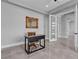Bright office space with a modern desk, neutral walls, and elegant mirror; perfect for a home workspace at 6235 N Fort Apache Rd, Las Vegas, NV 89149