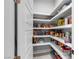Walk-in pantry with well-stocked shelves for organized storage at 6235 N Fort Apache Rd, Las Vegas, NV 89149