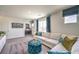 Living room featuring a neutral color palette with blue accents, and modern decor at 7437 Cooper Cove Dr # 30, North Las Vegas, NV 89084