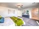 Bedroom with ceiling fan, blue accent wall, and a glimpse of the en-suite bathroom at 7437 Cooper Cove Dr # 30, North Las Vegas, NV 89084
