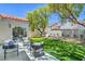 Backyard with patio and artificial grass offers lots of space for relaxing at 7772 Buckwood Ct, Las Vegas, NV 89149