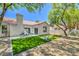 Beautiful backyard features artificial grass and a patio with plenty of shade at 7772 Buckwood Ct, Las Vegas, NV 89149