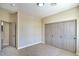 Neutral bedroom with a closet and a door leading to another room at 7772 Buckwood Ct, Las Vegas, NV 89149