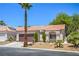 Charming single story home with a tile roof, desert landscaping, and a two car garage at 7772 Buckwood Ct, Las Vegas, NV 89149