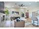 Spacious, open floor plan with a fireplace, lots of natural light, and modern decor at 7772 Buckwood Ct, Las Vegas, NV 89149