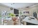 Open concept living space with wood floors, fireplace, and access to the backyard at 7772 Buckwood Ct, Las Vegas, NV 89149