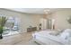 Bright bedroom with ensuite and slider to patio seating area at 7772 Buckwood Ct, Las Vegas, NV 89149