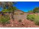 Sign for Painted Desert community is surrounded by landscaping at 7772 Buckwood Ct, Las Vegas, NV 89149